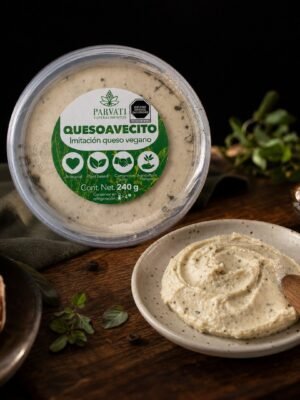 Quesoavecito Parvati — queso vegetal cremoso untable Quesoavecito de Parvati sobre fondo negro, vista hero